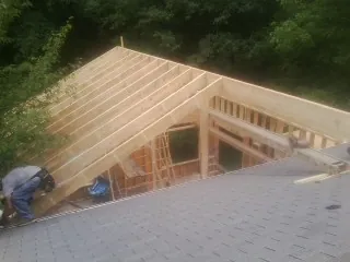 Framing a new roof addition that ties into an existing shingle roof in Waldo